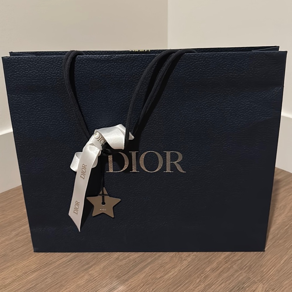 Dior empty shopping bag with ribbon and metal star